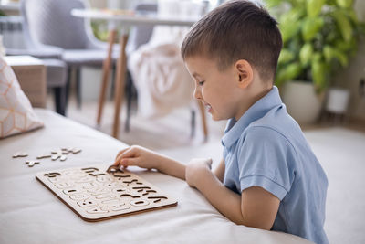 Side view of man working at home