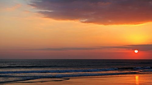 Scenic view of sea at sunset