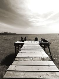 Pier over sea against sky