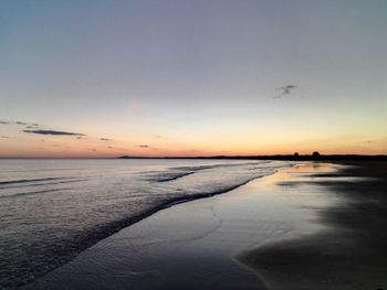 Scenic view of sea at sunset