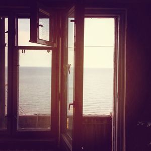 Scenic view of sea seen through window