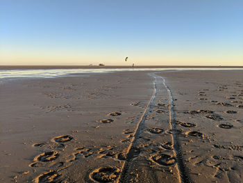 Scenic view of beach against clear sky