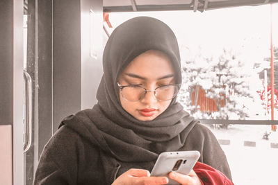 Young woman using mobile phone