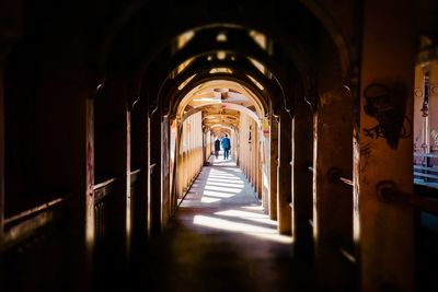 Man walking on high level bridge