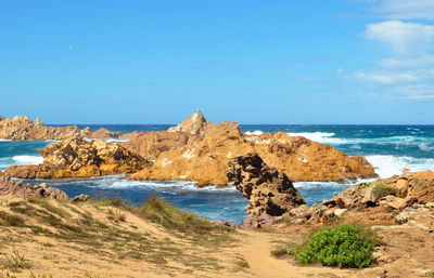 Scenic view of beach against clear sky