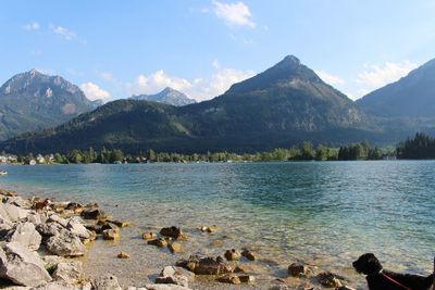 Scenic view of lake and mountains against sky