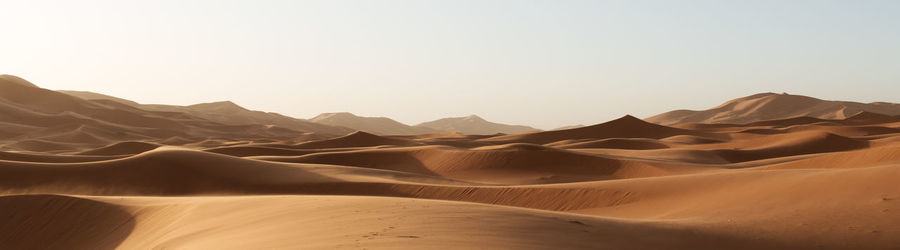 Scenic view of desert against clear sky