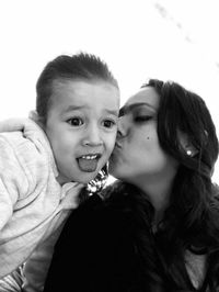 Close-up of smiling boy and woman