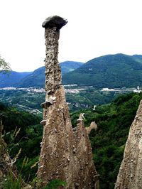 Scenic view of tree mountains against sky