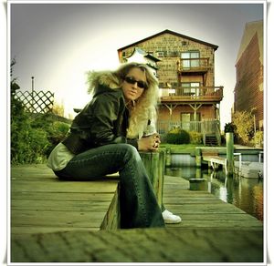 Young woman sitting outdoors