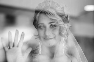 Close-up portrait of smiling young woman