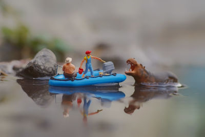 Close-up of stuffed toy floating on lake