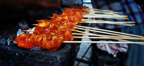 Close-up of meat on barbecue grill