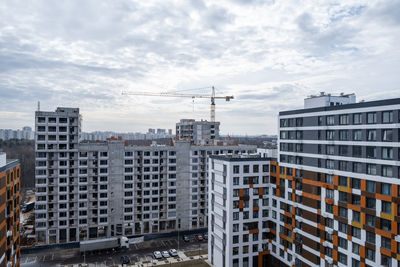 Buildings in city against sky