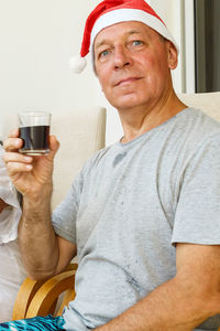 Portrait of man drinking glasses