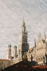 Buildings in city against sky