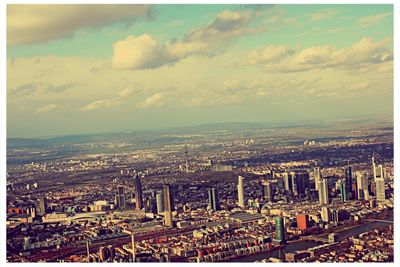 High angle view of city against cloudy sky