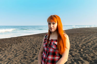 Portrait of young woman at beach