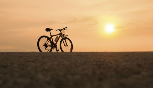 Bicycle with sunset or sunrise background