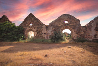 Historic building against sky during sunset