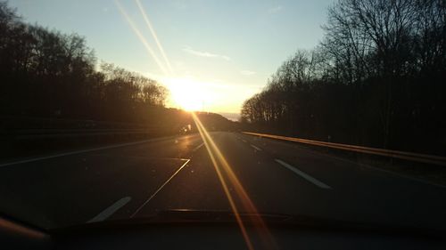 Road passing through forest