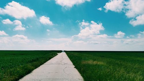 Scenic view of landscape against cloudy sky