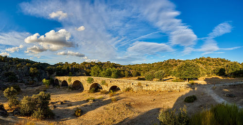 Panoramic of the mocho bridge, of roman origin, near the town of ledesma, spain