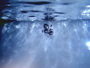 Close-up of woman swimming in water