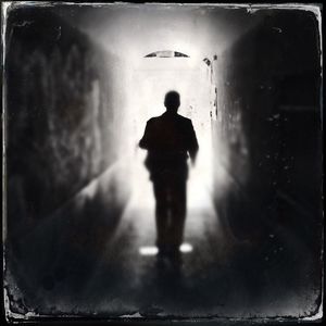 Full length of woman in dark room