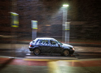 Blurred motion of car on road at night