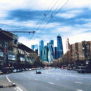 City skyline against cloudy sky