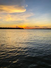 Scenic view of sea against romantic sky at sunset