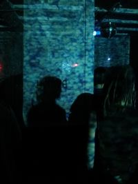 View of people in dark room