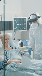 Female doctor examining patient in hospital