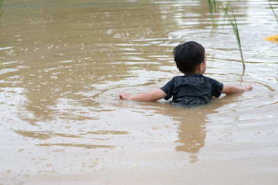 Boy playing in water