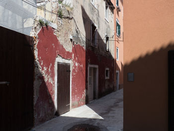 Narrow lane amidst buildings