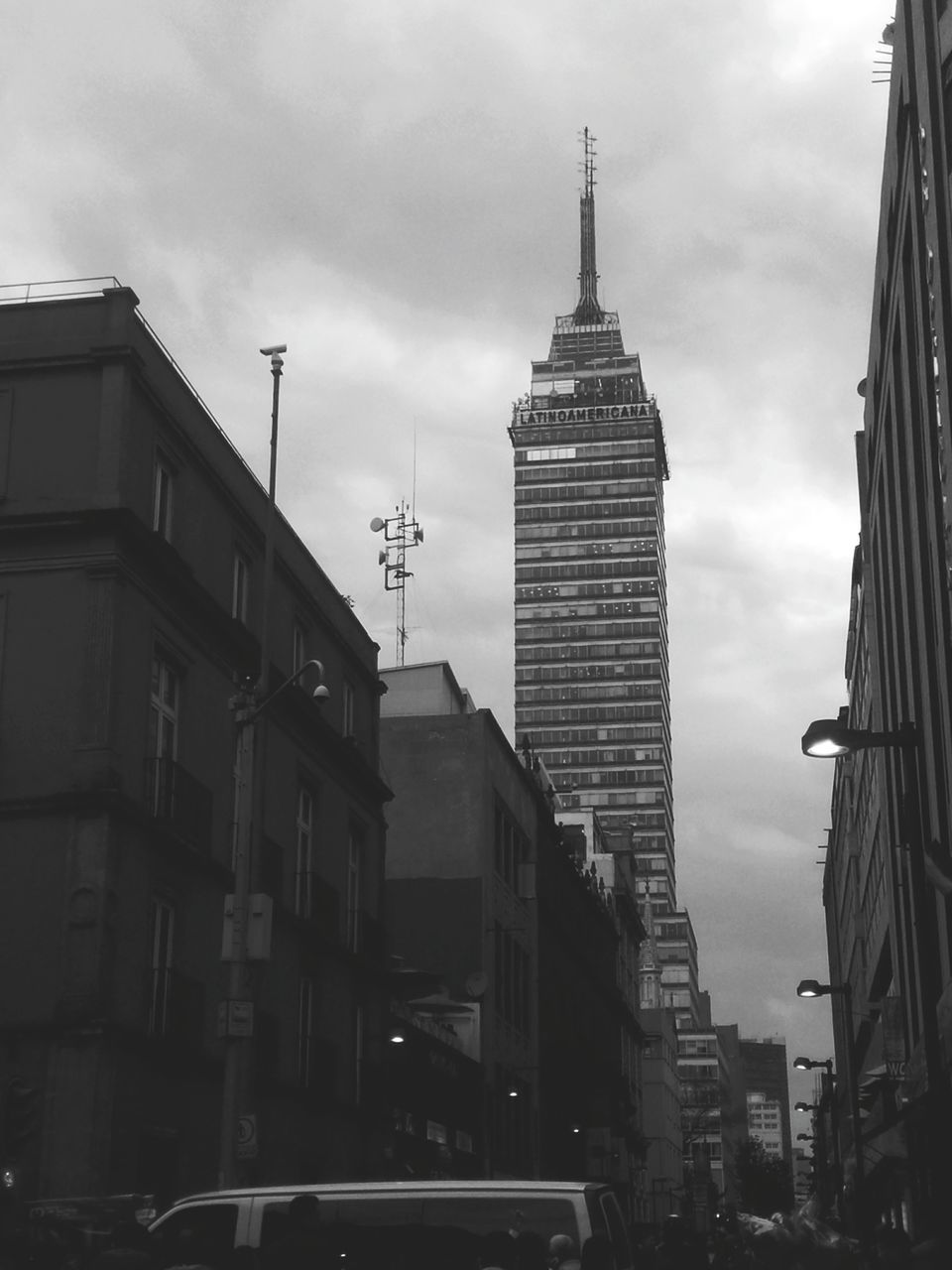 building exterior, architecture, built structure, city, sky, tall - high, tower, low angle view, cloud - sky, skyscraper, building, city life, capital cities, cloudy, office building, modern, travel destinations, outdoors, cloud, residential building