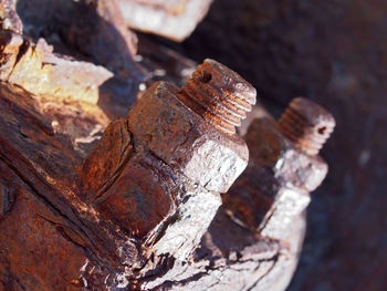 Close-up of rusty metal on wood