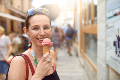 Portrait of mature woman eating ice cream