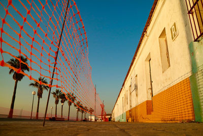 Low angle view of building against clear blue sky