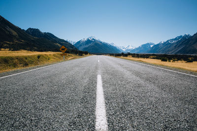 Surface level of road against mountain range