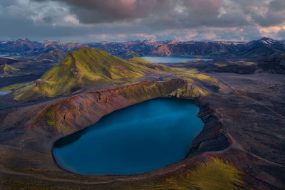 Aerial view of lake and mountains against sky