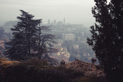 Foggy morning in city of bergamo.