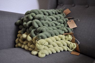 Stacked wools on sofa at home