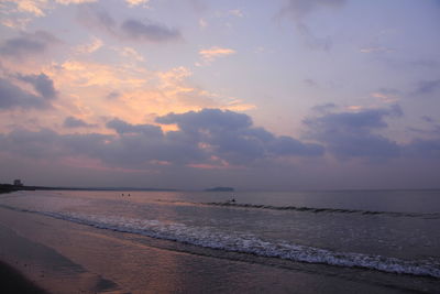 Scenic view of sea against cloudy sky