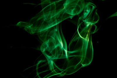 Close-up of smoke against black background