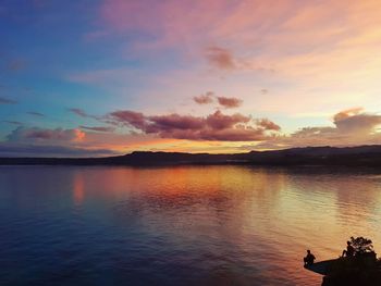 Scenic view of sea against sky at sunset