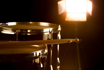 Close-up of electric lamp in the dark