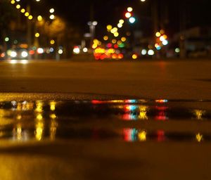Defocused image of illuminated city at night