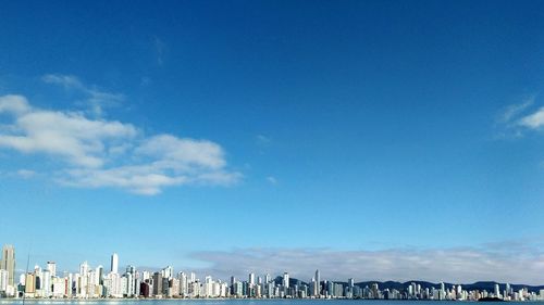 View of city against cloudy sky